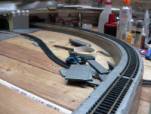Model railway layout with 10mm track screws holding Hornby track